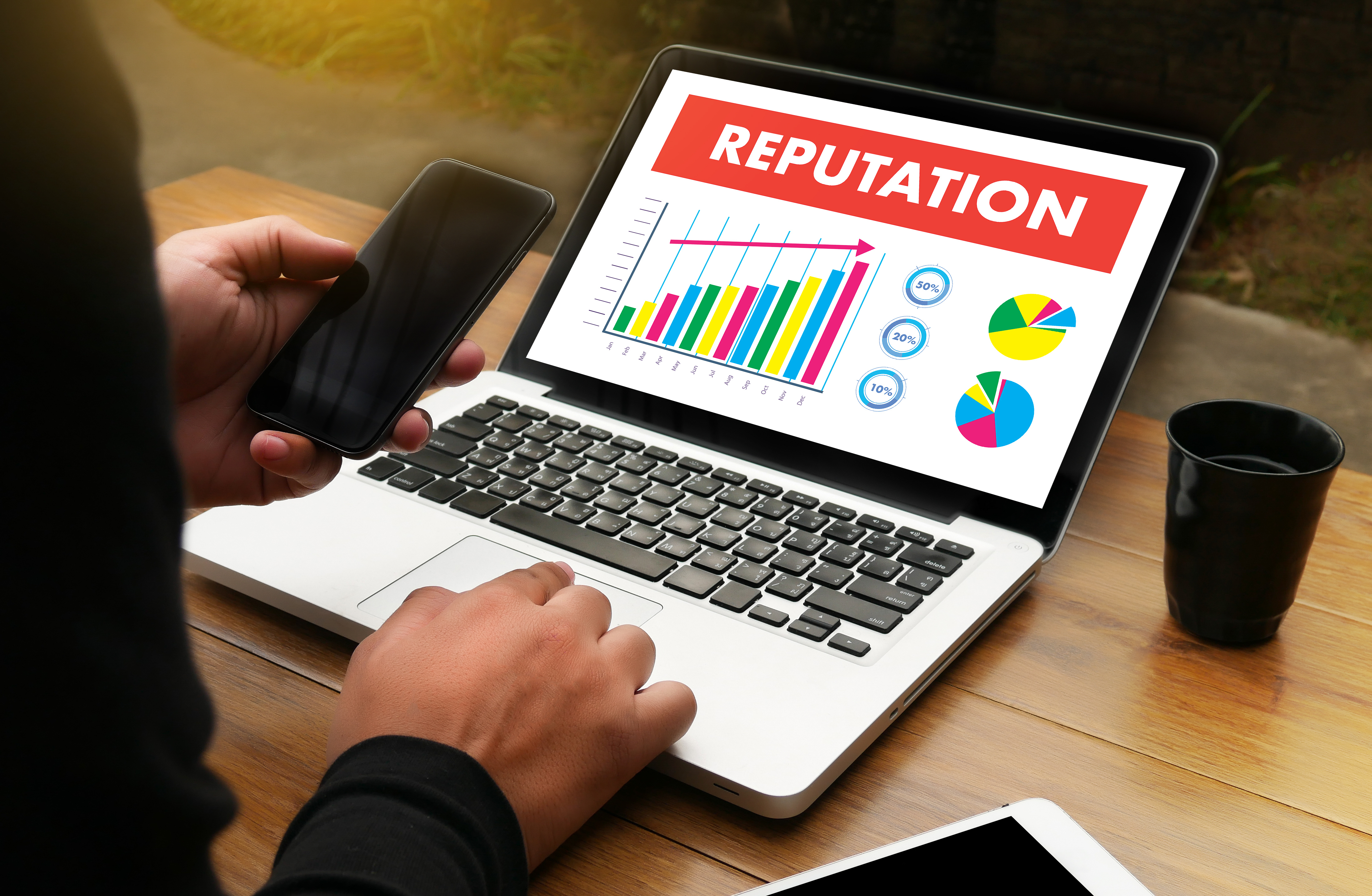laptop with image indicating improving reputaion